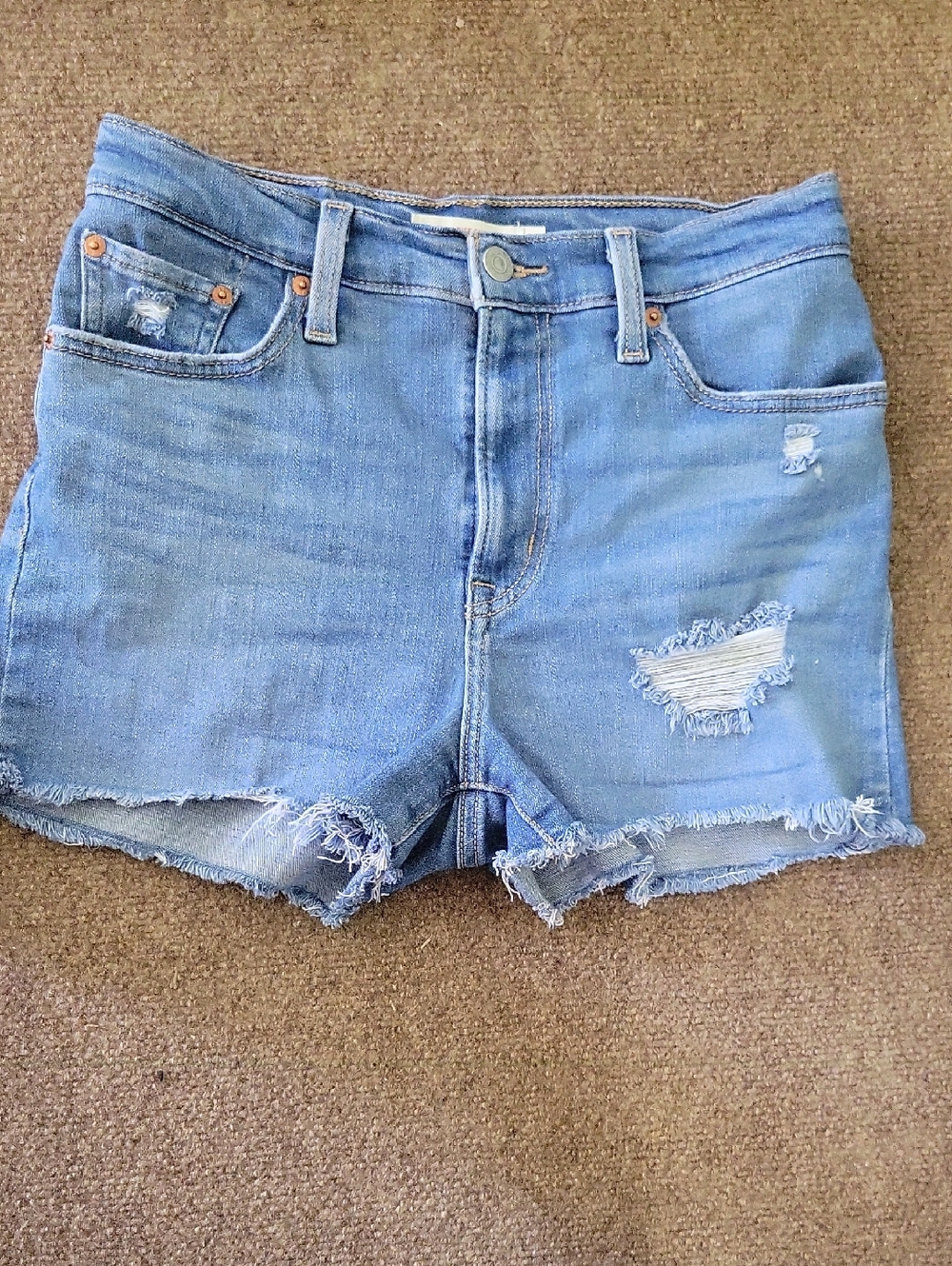 Levi’s Women’s High Rise Distressed Raw Hem Denim Shorts Size 28 Medium Wash